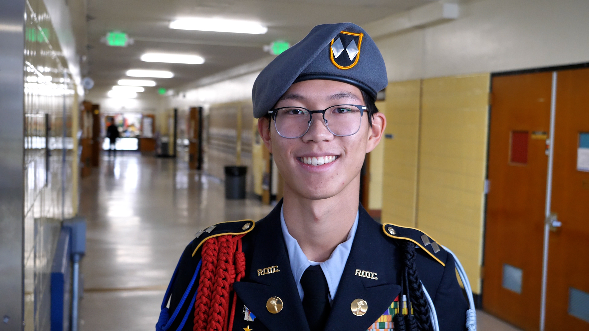  smiling student in hallway